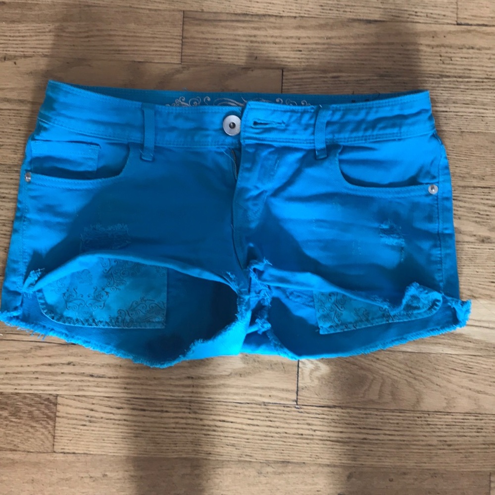 Sky blue distressed express shorts.